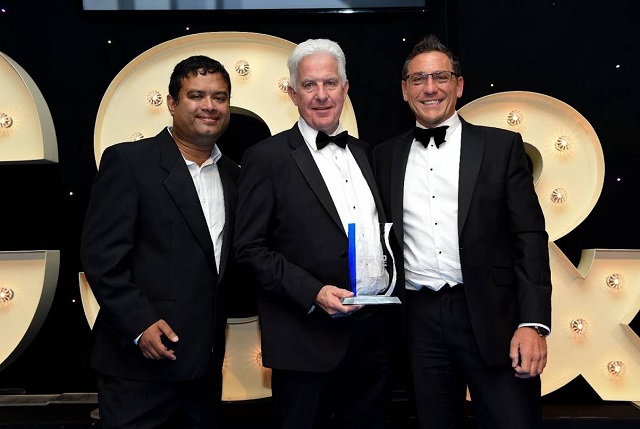 Joint Managing Director Peter Gray accepted Gray & Adams’ Refrigerated Trailer of the Year trophy from sponsor Mark Negri of Commercial Body Fittings, right, and awards presenter, comedian Paul Sinha