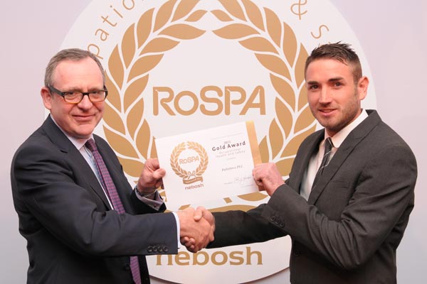 Michael Parker CBE, RoSPA Trustee, presents Ryan Birchnall, Health, Safety, Quality and Facilities Manager at Palletforce, with the gold RoSPA.